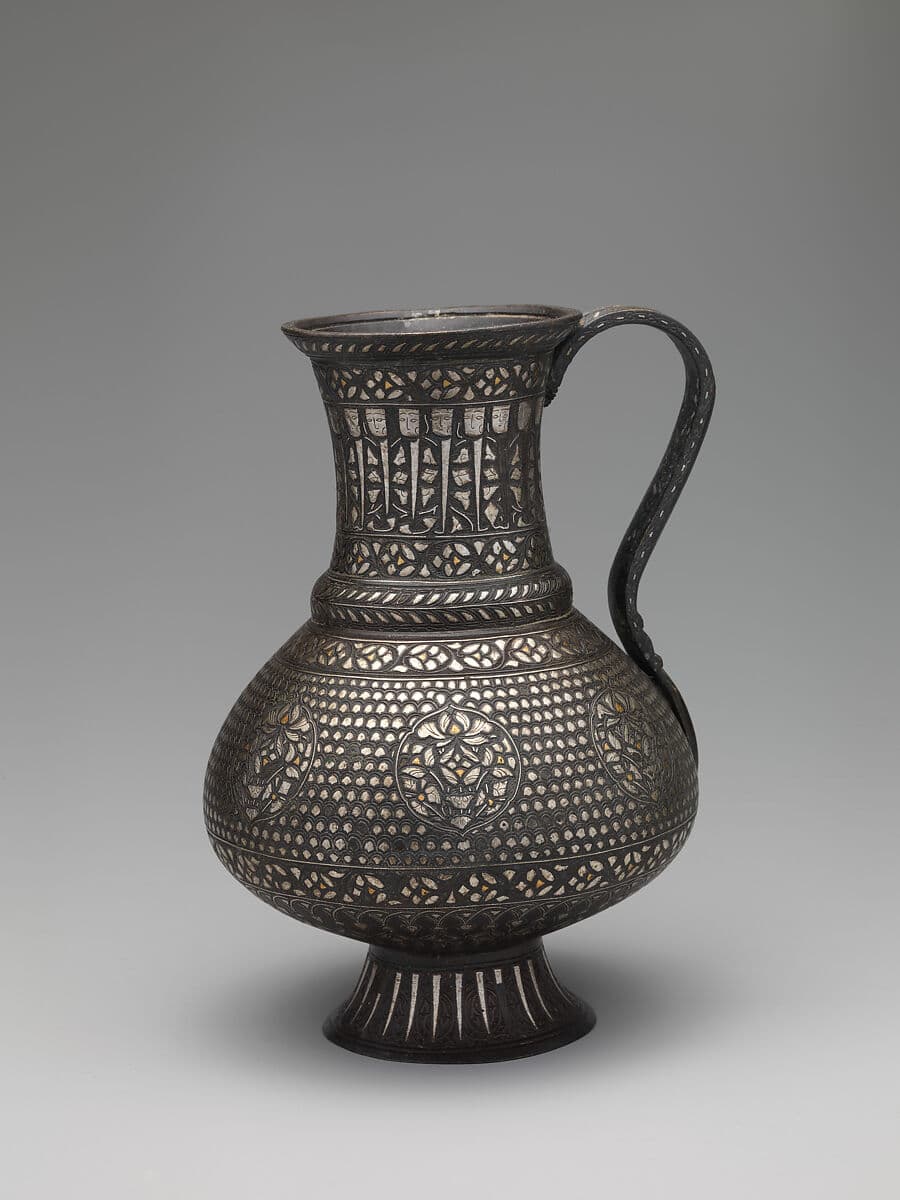 Complete inlaid bronze ewer, including its handle and foot, in The Metropolitan Museum of Art